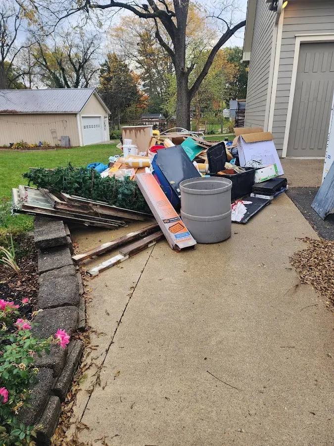 Dumpster being loaded with debris for Commercial Dumpster Rental in Signal Hill